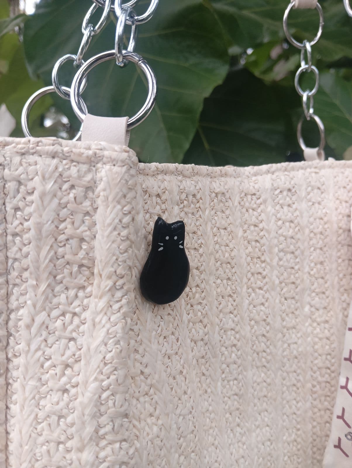Handmade Juesan tote bag charm photographed in monochrome